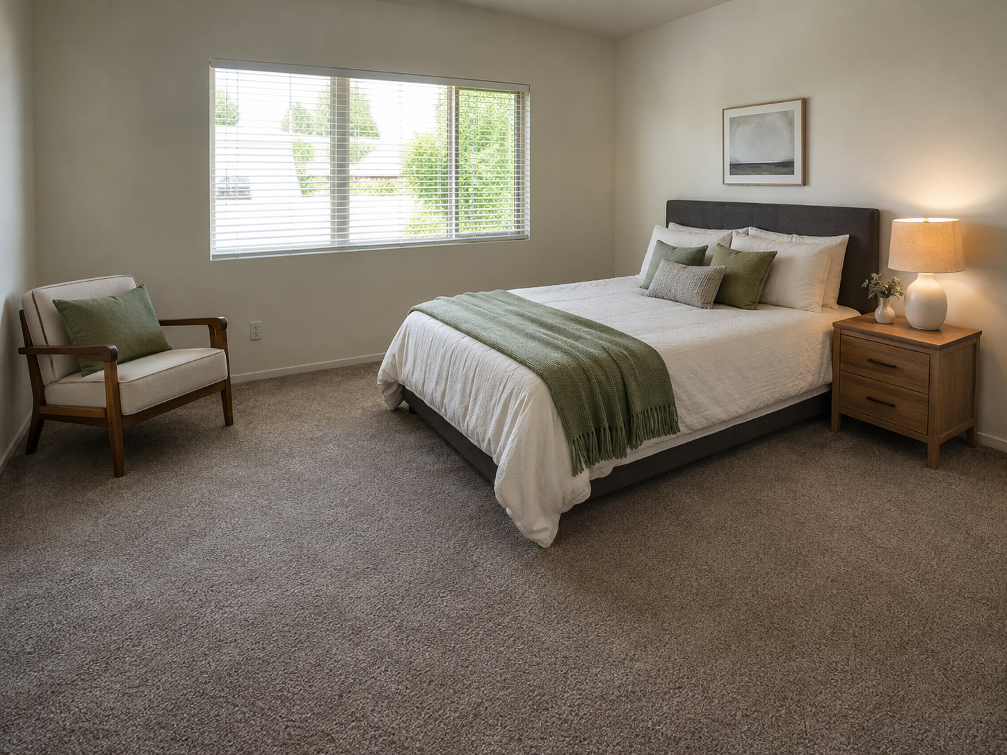 Neutral carpet in a simple rental bedroom setting