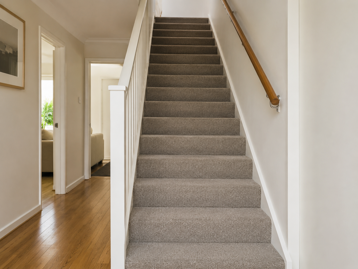 Main stairs with durable neutral carpet